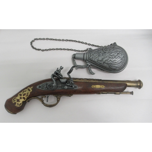 84 - Interior designer accessories: to include a painted plaster figure, a seated African woman, on a pli... 