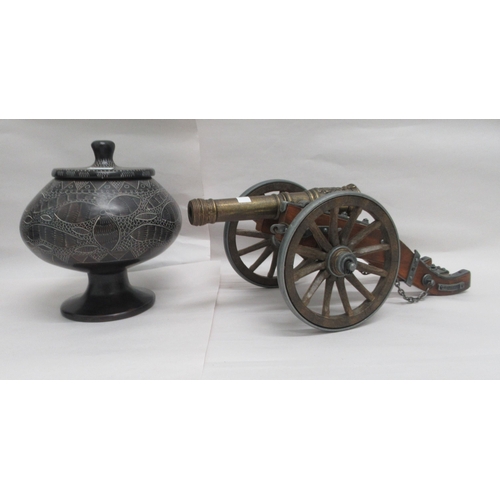 84 - Interior designer accessories: to include a painted plaster figure, a seated African woman, on a pli... 