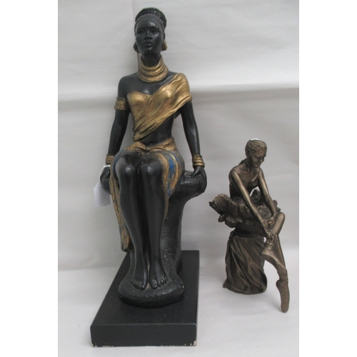 84 - Interior designer accessories: to include a painted plaster figure, a seated African woman, on a pli... 