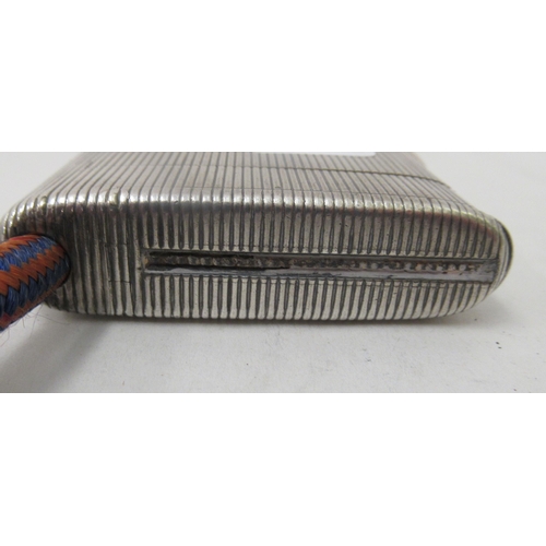 90 - An early 20thC G Keller French silver coloured metal cigarette case with a ribbed body and hinged li... 