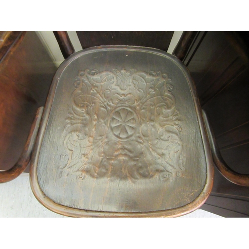 96 - An early/mid 20thC stained beech, panelled and bentwood framed open arm chair&nbsp;