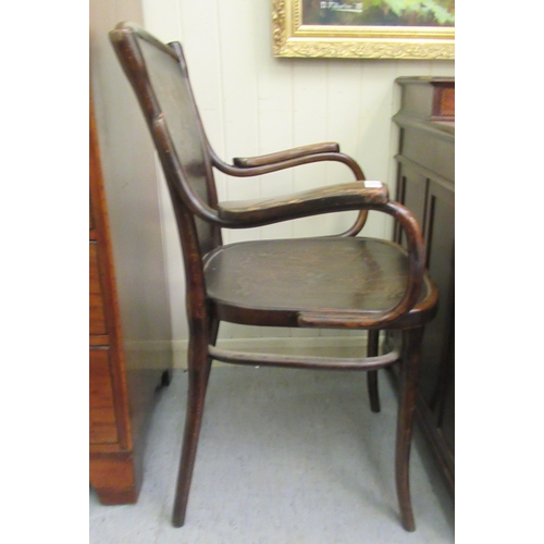 96 - An early/mid 20thC stained beech, panelled and bentwood framed open arm chair&nbsp;