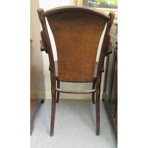 96 - An early/mid 20thC stained beech, panelled and bentwood framed open arm chair&nbsp;
