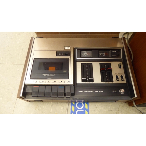 216 - Stereo equipment, viz. a Bush Arena 3 waveband radio; an Alwa Creators stereo; a Garrard automatic t... 