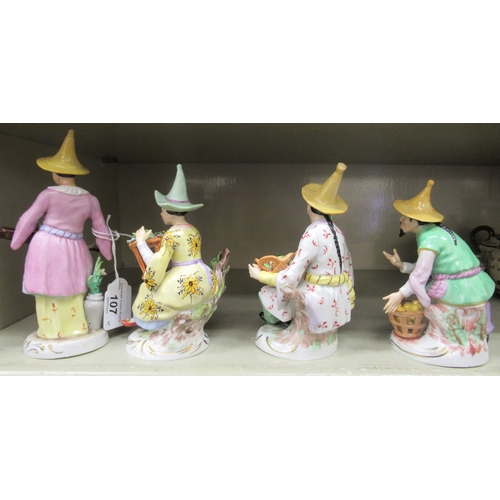 107 - A series of four early 20thC Sitzendorf porcelain figures, featuring Chinese men and women&nbsp; lar... 
