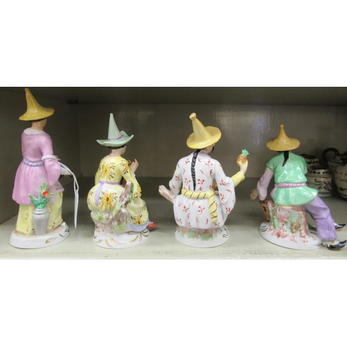 107 - A series of four early 20thC Sitzendorf porcelain figures, featuring Chinese men and women&nbsp; lar... 