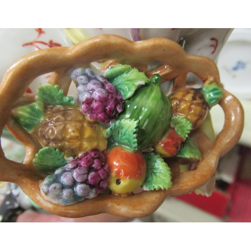 107 - A series of four early 20thC Sitzendorf porcelain figures, featuring Chinese men and women&nbsp; lar... 