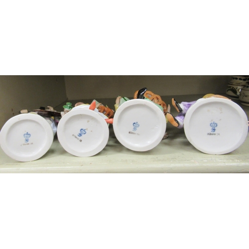 107 - A series of four early 20thC Sitzendorf porcelain figures, featuring Chinese men and women&nbsp; lar... 