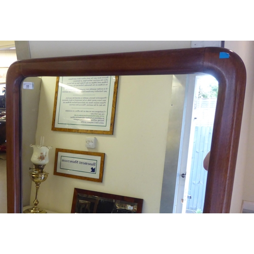 55 - A Victorian style dressing mirror, set in a plain, cushion moulded mahogany frame&nbsp; 63