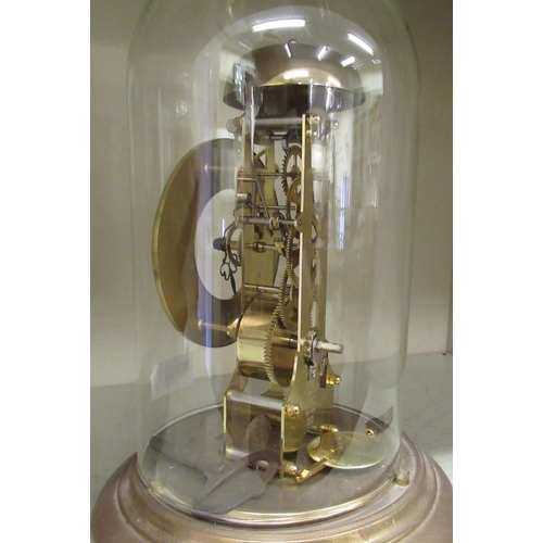 82 - A President lacquered brass anniversary clock; the movement faced by an enamelled Roman dial, under ... 