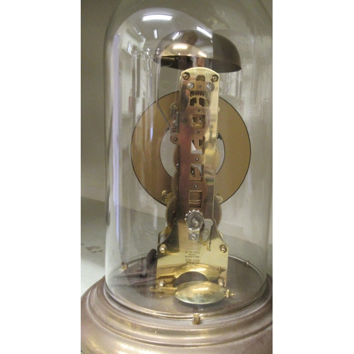 82 - A President lacquered brass anniversary clock; the movement faced by an enamelled Roman dial, under ... 