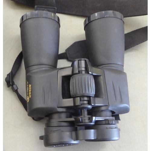 112 - A pair of SkyMaster 15x70 binoculars; and another pair of Nikon Action-ex 10x50 example