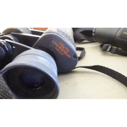 112 - A pair of SkyMaster 15x70 binoculars; and another pair of Nikon Action-ex 10x50 example