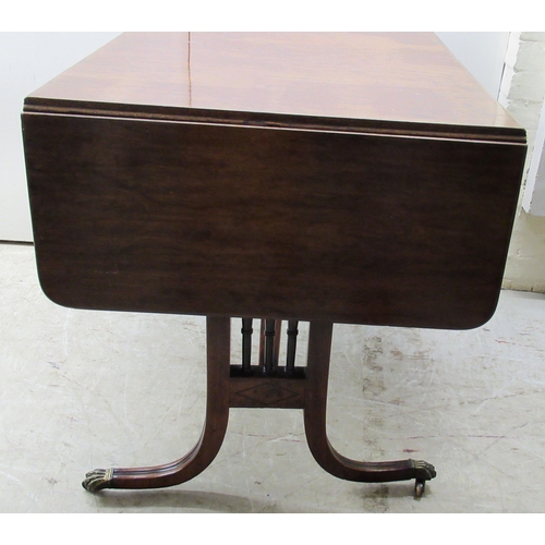 115 - A 19thC mahogany sofa table with ebony string inlaid decoration, the top having a reeded edge, over ... 