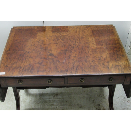 115 - A 19thC mahogany sofa table with ebony string inlaid decoration, the top having a reeded edge, over ... 