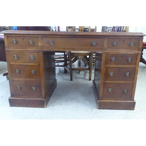 133 - A late Victorian mahogany nine drawer, twin pedestal desk  29