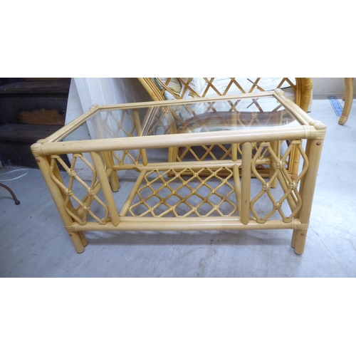 148 - Conservatory furniture: to include a caned framed three piece suite with floral patterned fabric cov... 