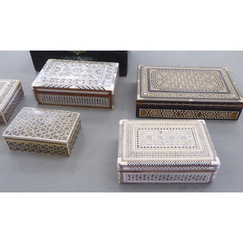 151 - 20thC boxes: to include an Indian bone and mother-of-pearl inlaid fruitwood example  2