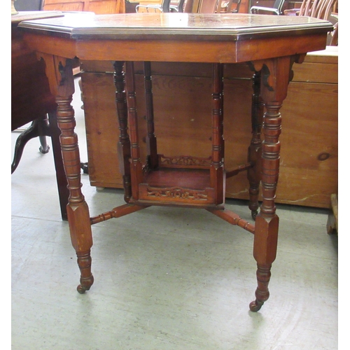 157 - An Edwardian walnut occasional table, the octagonal top raised on ring turned and block supports, un... 