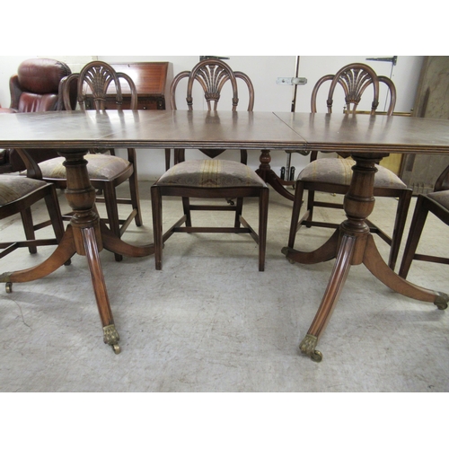 158 - A Regency style crossbanded mahogany twin pedestal dining table, raised on splayed legs  29