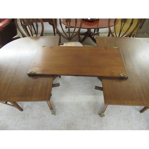 158 - A Regency style crossbanded mahogany twin pedestal dining table, raised on splayed legs  29