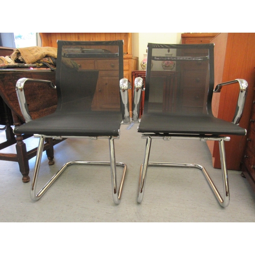 179 - A pair of modern chrome finished cantilever design chairs, each with a woven mesh material back and ... 