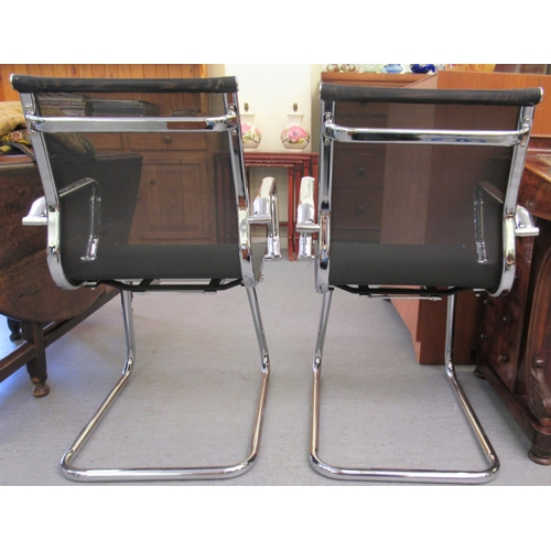 179 - A pair of modern chrome finished cantilever design chairs, each with a woven mesh material back and ... 