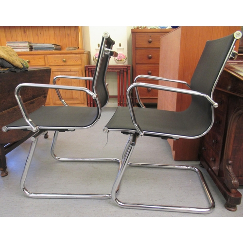 179 - A pair of modern chrome finished cantilever design chairs, each with a woven mesh material back and ... 