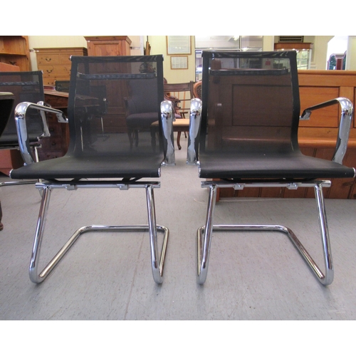 180 - A pair of modern chrome finished cantilever design chairs, each with a woven mesh material back and ... 