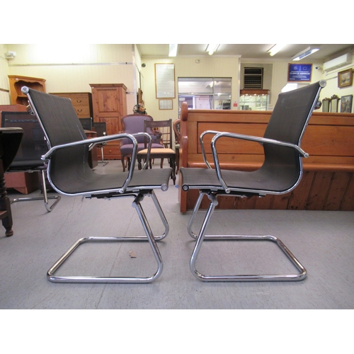 180 - A pair of modern chrome finished cantilever design chairs, each with a woven mesh material back and ... 