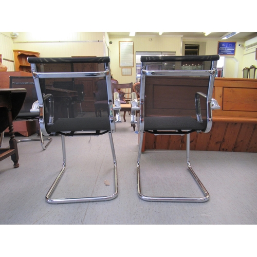 180 - A pair of modern chrome finished cantilever design chairs, each with a woven mesh material back and ... 