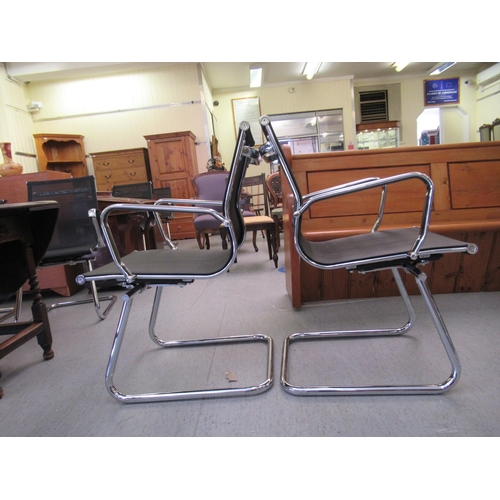 180 - A pair of modern chrome finished cantilever design chairs, each with a woven mesh material back and ... 