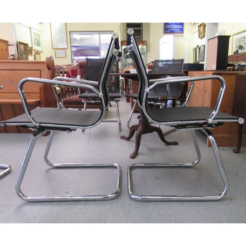 181 - A pair of modern chrome finished cantilever design chairs, each with a woven mesh material back and ... 