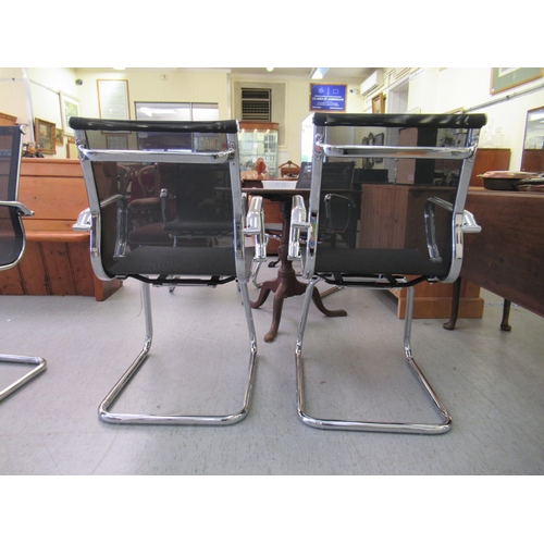 181 - A pair of modern chrome finished cantilever design chairs, each with a woven mesh material back and ... 