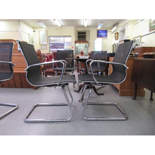 181 - A pair of modern chrome finished cantilever design chairs, each with a woven mesh material back and ... 