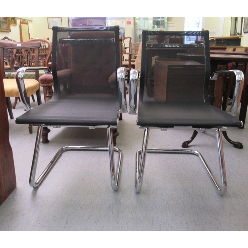 182 - A pair of modern chrome finished cantilever design chairs, each with a woven mesh material back and ... 