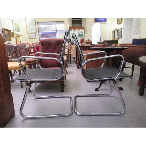 182 - A pair of modern chrome finished cantilever design chairs, each with a woven mesh material back and ... 