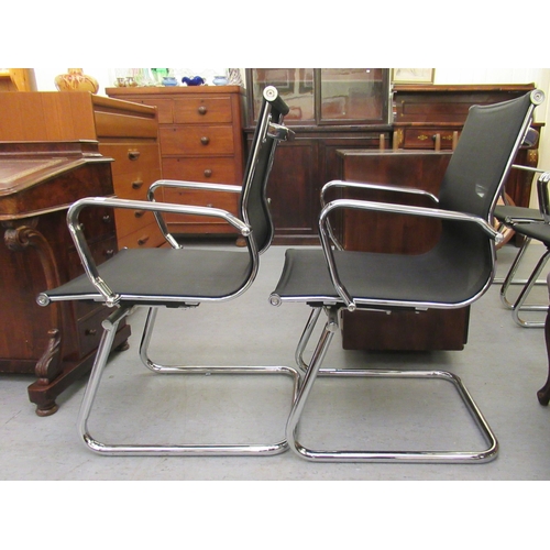 183 - A pair of modern chrome finished cantilever design chairs, each with a woven mesh material back and ... 