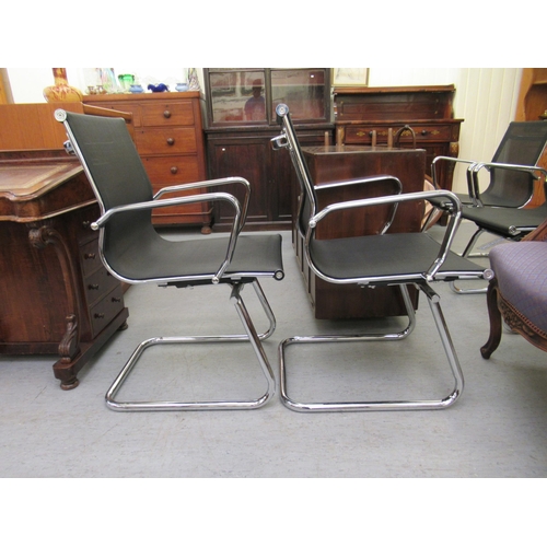 183 - A pair of modern chrome finished cantilever design chairs, each with a woven mesh material back and ... 