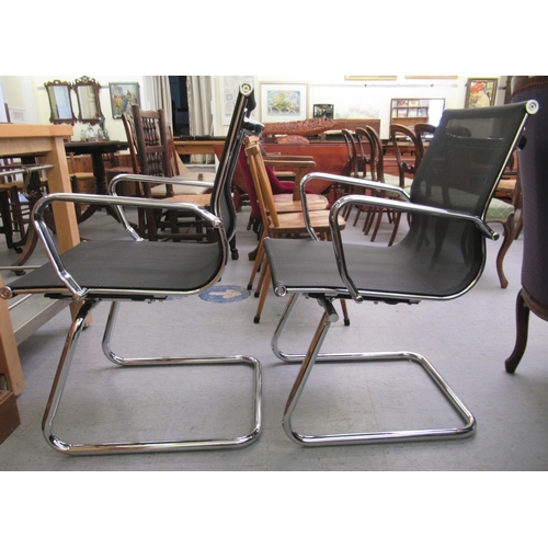 184 - A pair of modern chrome finished cantilever design chairs, each with a woven mesh material back and ... 