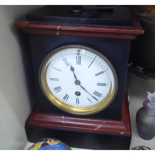 198 - A mixed lot: to include a 1920s/30s slate and marbleised effect mantel clock; faced by a Roman dial&... 