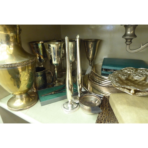 203 - Silver plated tableware: to include a set of six goblets, place mats, cutlery and flatware