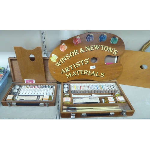 204 - Artists' related items: to include a Windsor & Newton's palette and two boxes of paints and brus... 