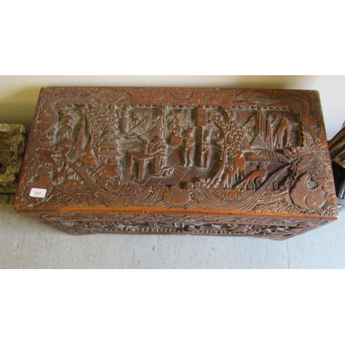 231 - A mid 20thC Chinese camphorwood chest, ornately carved with landscapes, raised on bracket feet  15