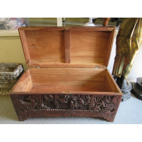 231 - A mid 20thC Chinese camphorwood chest, ornately carved with landscapes, raised on bracket feet  15