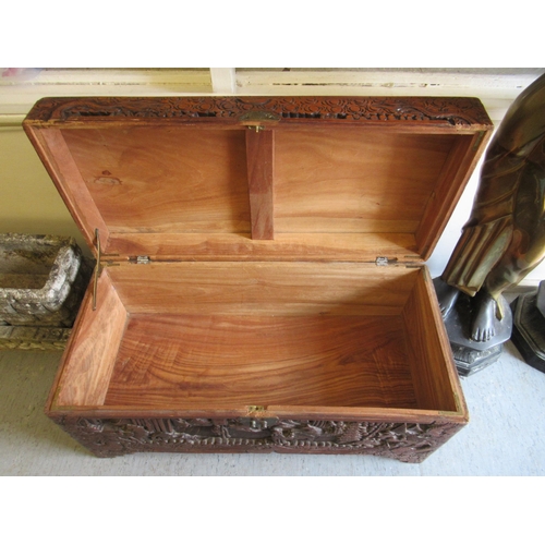 231 - A mid 20thC Chinese camphorwood chest, ornately carved with landscapes, raised on bracket feet  15