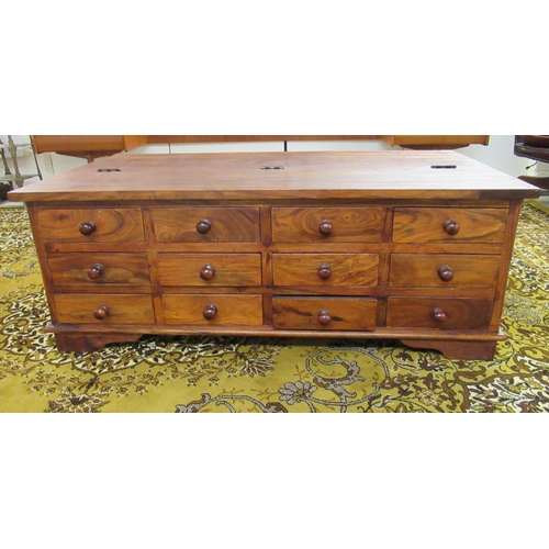 233 - A modern hardwood coffee table with a hinged lid, on a plinth  17