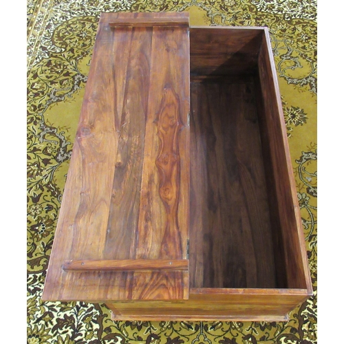 233 - A modern hardwood coffee table with a hinged lid, on a plinth  17