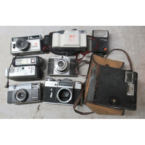 234 - Photographic equipment and accessories: to include an Olympus Trip 35 camera; and a Praktica PL nava... 