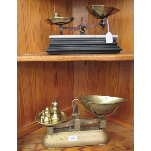 236 - Two sets of late Victorian cast metal grocer's scales with attendant weights